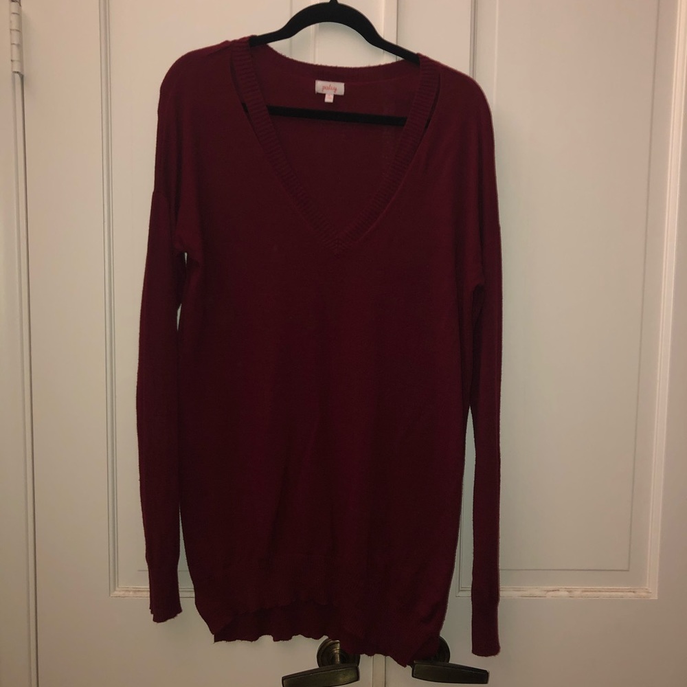 Tunic-like sweater with neckline detail.